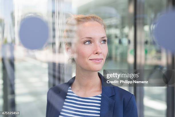 business women behind window - gestreifter blazer stock-fotos und bilder