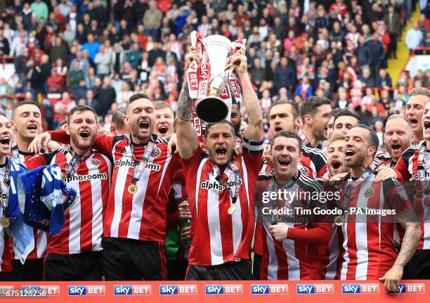 Sheffield United's Billy Sharp lifts the Sky Bet League One trophy after the Sky Bet League One match at Bramall Lane, Sheffield.