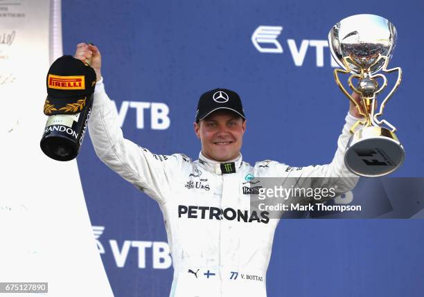 Race winner Valtteri Bottas of Finland and Mercedes GP celebrates on the podium during the Formula One Grand Prix of Russia on April 30, 2017 in...