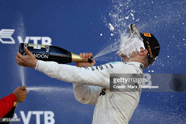 Race winner Valtteri Bottas of Finland and Mercedes GP celebrates on the podium during the Formula One Grand Prix of Russia on April 30, 2017 in...