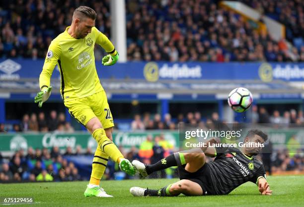 Diego Costa of Chelsea fouls Maarten Stekelenburg of Everton during the Premier League match between Everton and Chelsea at Goodison Park on April...