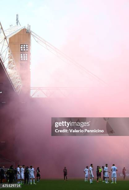 Genoa CFC supporters throw smoke bombs and flares during the Serie A match between Genoa CFC and AC ChievoVerona at Stadio Luigi Ferraris on April...