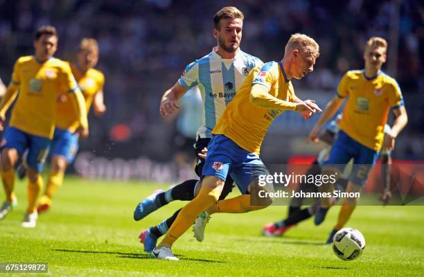 Marin Pongracic of Muenchen fights for the Ball with Saulo Decarli of Braunschweig during the Second Bundesliga match between TSV 1860 Muenchen and...