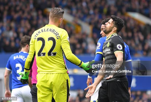 Maarten Stekelenburg of Everton and Diego Costa of Chelsea speak to each other after a challenge during the Premier League match between Everton and...
