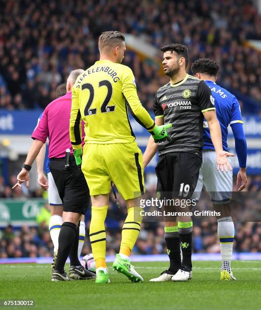 Maarten Stekelenburg of Everton and Diego Costa of Chelsea speak to each other after a challenge during the Premier League match between Everton and...