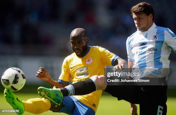 Sebastian Boenisch of Muenchen fights for the Ball with Domi Kumbela of Braunschweig during the Second Bundesliga match between TSV 1860 Muenchen and...