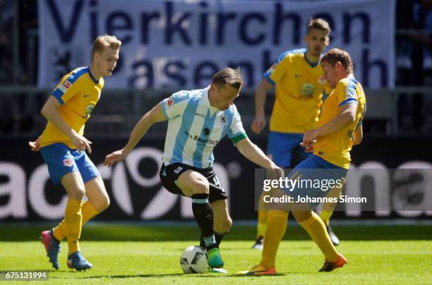 Ivica Olic of Muenchen fights for the ball with Maximilian Sauer and Jan Hochscheidt of Braunschweig during the Second Bundesliga match between TSV...