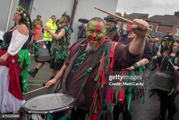 People follow as the Glastonbury Dragons are paraded through the town as part of the Glastonbury Dragon's May Fayre which is part of the town's...