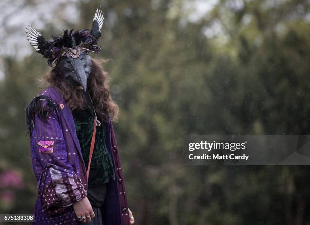 Performers entertain the crowd ahead of the Glastonbury Dragons being paraded through the town as part of the Glastonbury Dragon's May Fayre which is...