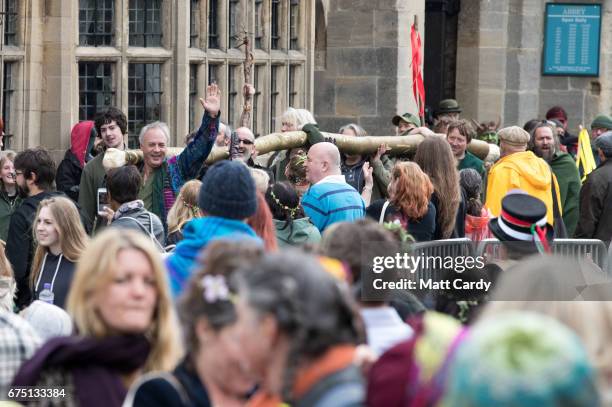 The Glastonbury Green Men cheer as they move the Maypole to be used in the town's Beltane and May Day celebrations on April 30, 2017 in Glastonbury,...