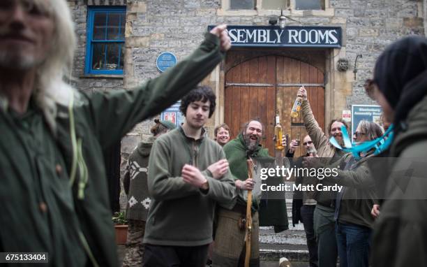 The Glastonbury Green Men cheer as they move the Maypole to be used in the town's Beltane and May Day celebrations on April 30, 2017 in Glastonbury,...