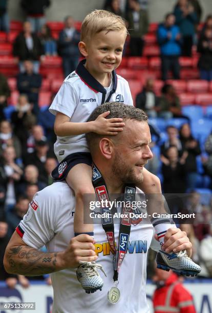 Bolton Wanderers' Jay Spearing celebrate with his son after the match during the Sky Bet League One match between Bolton Wanderers and Peterborough...