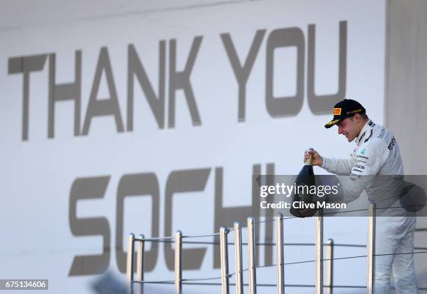 Race winner Valtteri Bottas of Finland and Mercedes GP celebrates on the podium during the Formula One Grand Prix of Russia on April 30, 2017 in...