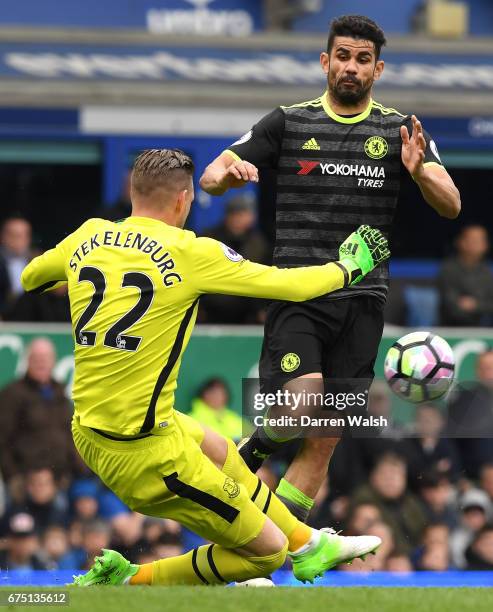 Maarten Stekelenburg of Everton and Diego Costa of Chelsea colide during the Premier League match between Everton and Chelsea at Goodison Park on...