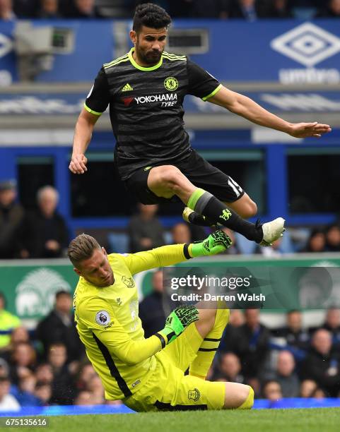 Maarten Stekelenburg of Everton and Diego Costa of Chelsea colide during the Premier League match between Everton and Chelsea at Goodison Park on...