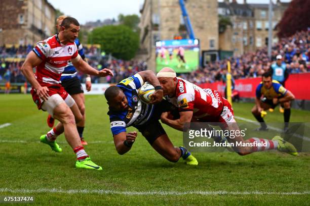 Aled Brew of Bath dives to touch down a try during the Aviva Premiership match between Bath Rugby and Gloucester Rugby at the Recreation Ground on...