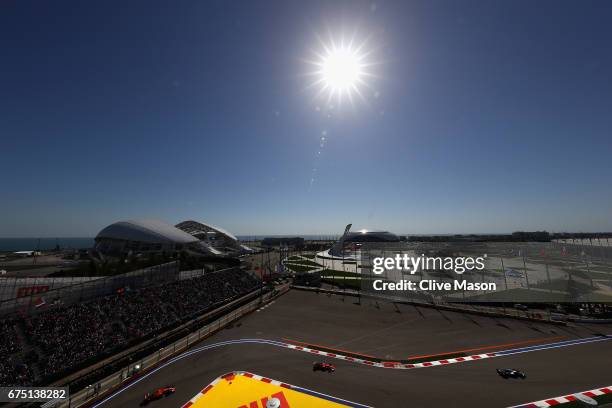 Valtteri Bottas driving the Mercedes AMG Petronas F1 Team Mercedes F1 WO8 leads Sebastian Vettel of Germany driving the Scuderia Ferrari SF70H and...