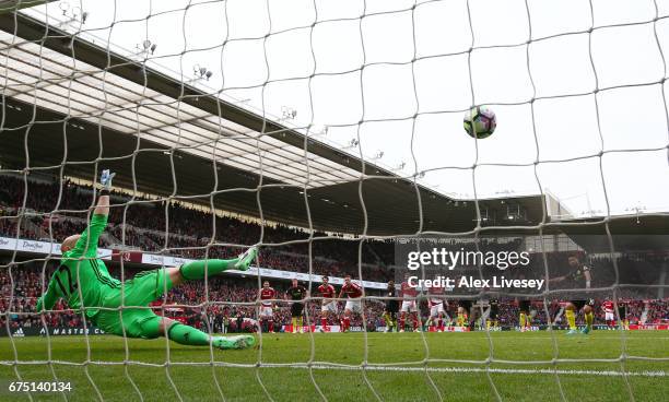 Sergio Aguero of Manchester City scores his sides first goal from the penalty spot past Brad Guzan of Middlesbrough during the Premier League match...