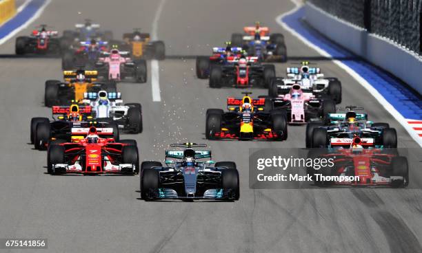 Valtteri Bottas driving the Mercedes AMG Petronas F1 Team Mercedes F1 WO8 leads the field into turn 2 at the start during the Formula One Grand Prix...