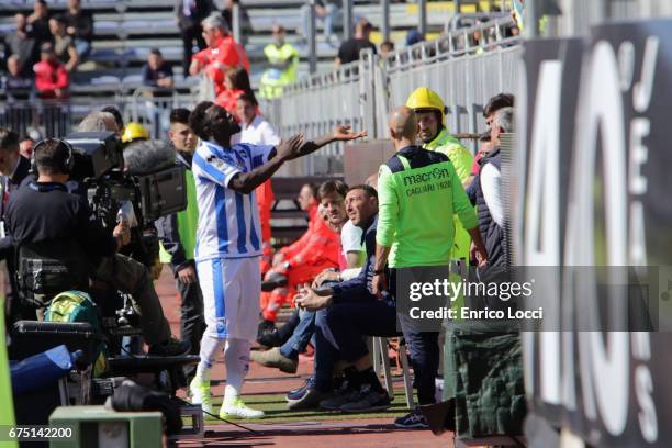 Sulley Muntari of Pescara react with the supporters during the Serie A match between Cagliari Calcio and Pescara Calcio at Stadio Sant'Elia on April...