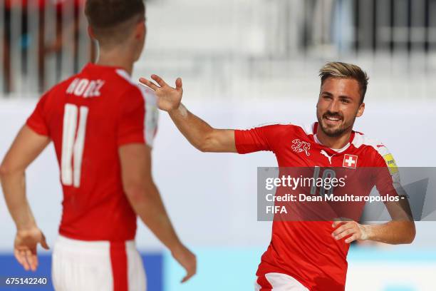 Noel Ott of Switzerland celebrates scoring a goal with team mate Glenn Hodel during the FIFA Beach Soccer World Cup Bahamas 2017 group A match...