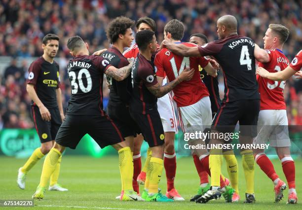 Teammates pull apart Manchester City's German midfielder Leroy Sane and Middlesbrough's Dutch midfielder Marten de Roon as they confront each other...