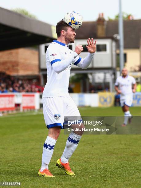 Josh Law of Oldham Athletic heads the ball during the Sky Bet League One match between A.F.C Wimbledon and Oldham Athletic at The Cherry Red Records...