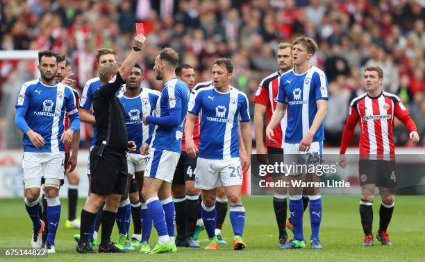 Dan Gardener of Chesterfield is given a red card by referee John Busby during the Sky Bet League One match between Sheffield United and Chesterfield...