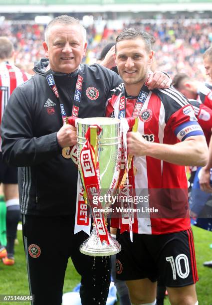 Chris Wilder, Sheffield United manager and Billy Sharp, Captain of Sheffield United celebrate as they win promotion into next seasons Sky Bet...