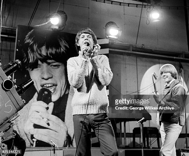 Singer Mick Jagger and guitarist Brian Jones of The Rolling Stones, during rehearsals for an episode of the Friday night TV pop/rock show 'Ready...