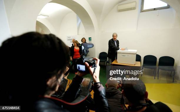 Italian Prime Minister Paolo Gentiloni casts his ballot at the primary elections of the Italian Democratic Party leadership in Rome, Italy, on April...