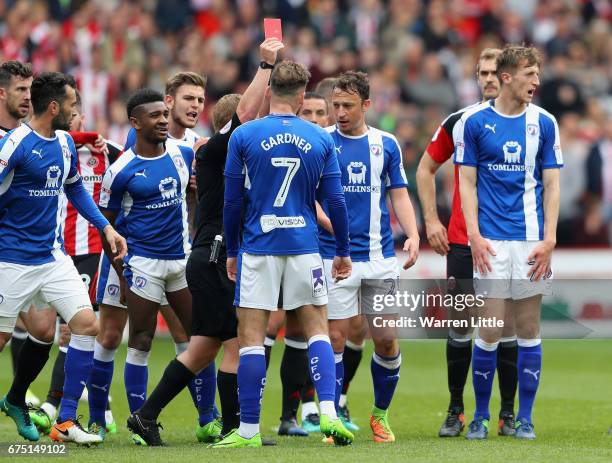 Dan Gardener of Chesterfield is given a red card by referee John Busby during the Sky Bet League One match between Sheffield United and Chesterfield...