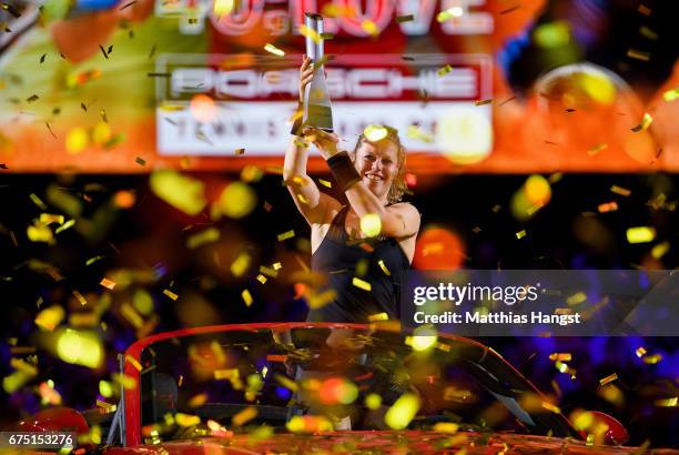 Laura Siegemund of Germany celebrates with the trophy after the singles final match against Kristina Mladenovic of France on Day 7 of the Porsche...