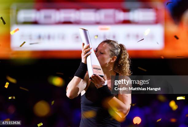 Laura Siegemund of Germany celebrates with the trophy after the singles final match against Kristina Mladenovic of France on Day 7 of the Porsche...