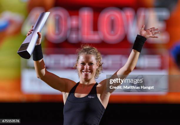 Laura Siegemund of Germany celebrates with the trophy after the singles final match against Kristina Mladenovic of France on Day 7 of the Porsche...