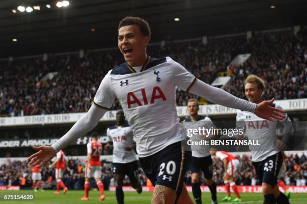 Tottenham Hotspur's English midfielder Dele Alli celebrates scoring the opening goal during the English Premier League football match between...