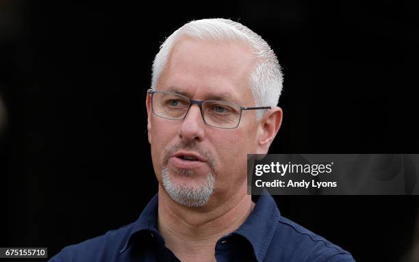 Todd Pletcher the trainer of Always Dreaming, Patch and Tapwirit talks in the barn area during the morning training for the Kentucky Derby at...