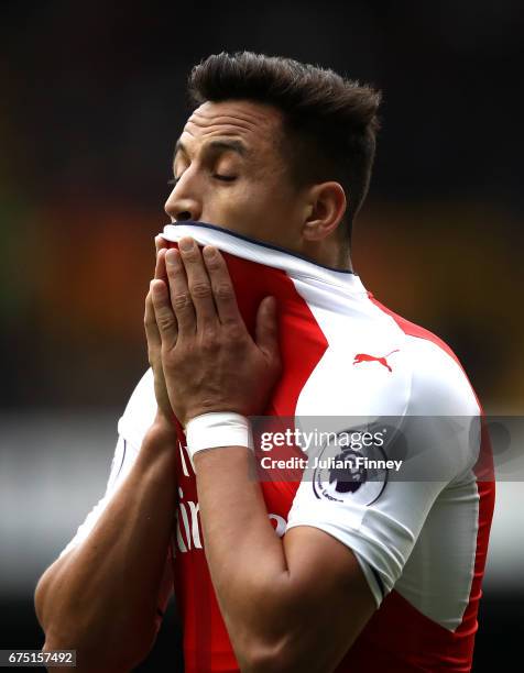 Alexis Sanchez of Arsenal reacts during the Premier League match between Tottenham Hotspur and Arsenal at White Hart Lane on April 30, 2017 in...