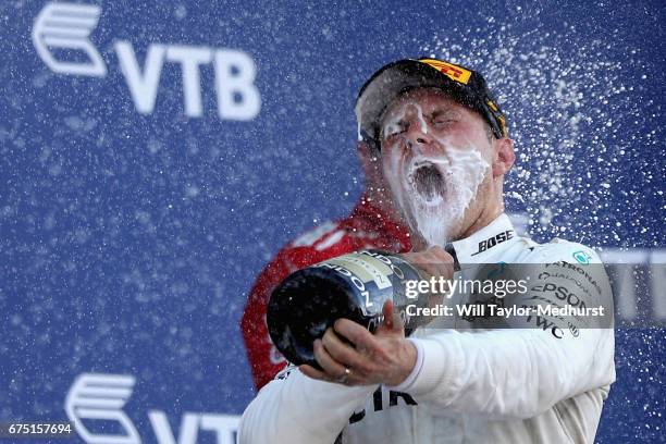 Race winner Valtteri Bottas of Finland and Mercedes GP celebrates on the podium during the Formula One Grand Prix of Russia on April 30, 2017 in...