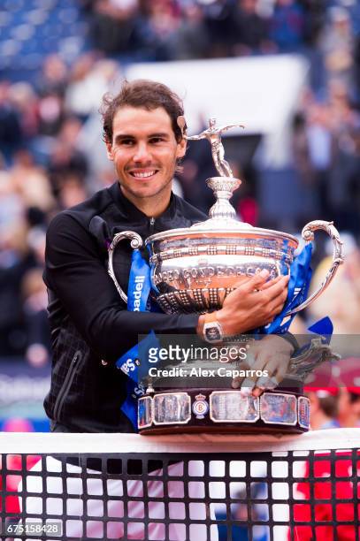 Rafael Nadal of Spain poses with the trophy after his victory against Dominic Thiem of Austria in their final match on day seven of the Barcelona...
