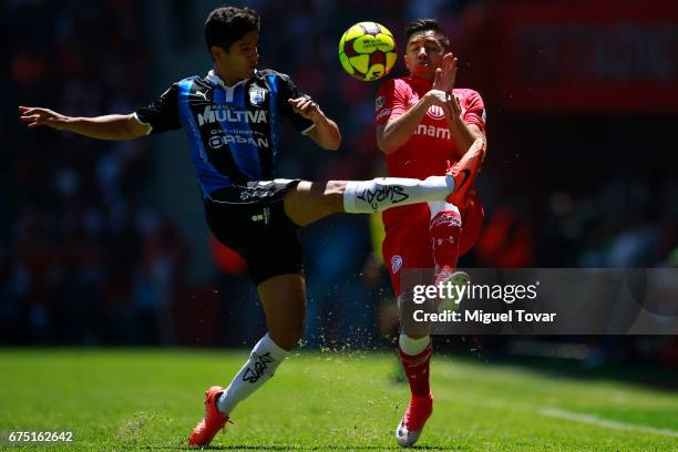 Efrain Velarde of Toluca fights for the ball with Jaime Gomez of Queretaro during the 16th round match between Toluca and Queretaro as part of the...