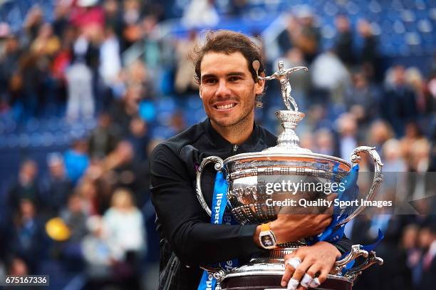 Rafael Nadal of Spain celebrates with the trophy after winning his match against Dominic Thiem of Austria during the Day 6 of the Barcelona Open Banc...