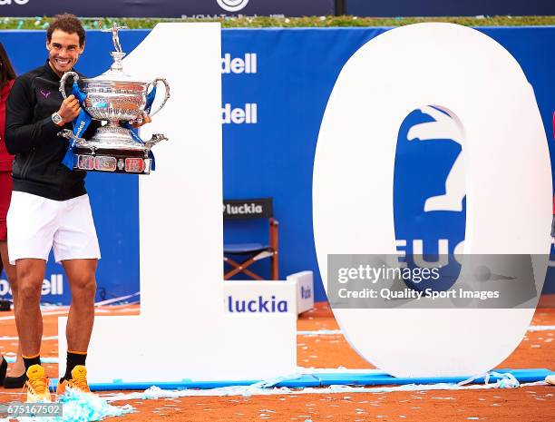 Rafael Nadal of Spain celebrates with the trophy after winning his match against Dominic Thiem of Austria during the Day 6 of the Barcelona Open Banc...