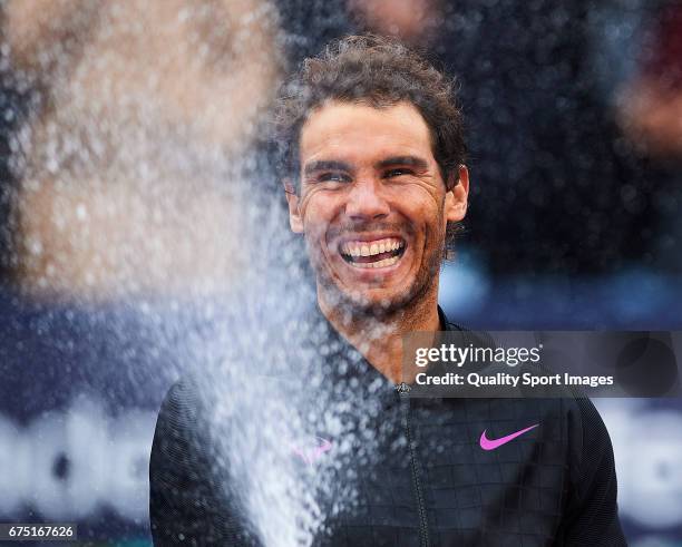 Rafael Nadal of Spain celebrates with the trophy after winning his match and become Champion of the Barcelona Open Banc Sabadell against Dominic...