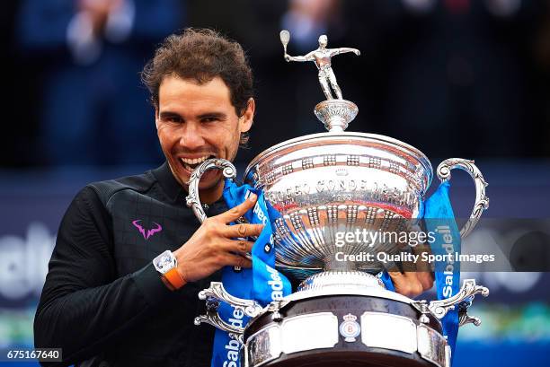 Rafael Nadal of Spain celebrates with the trophy after winning his match and become Champion of the Barcelona Open Banc Sabadell against Dominic...