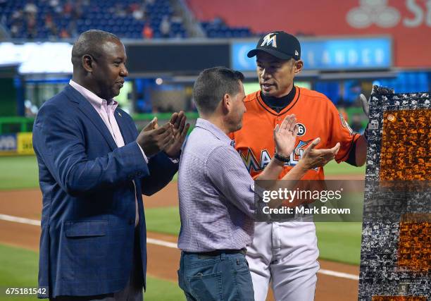 President of the Miami Marlins David P. Samson and President of Baseball Operations Michael Hill honor Ichiro Suzuki of the Miami Marlins for his...