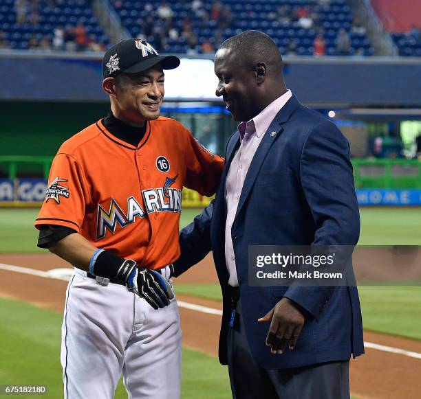 President of Baseball Operations Michael Hill with Ichiro Suzuki of the Miami Marlins for his 3000th hit honor before the game between the Miami...