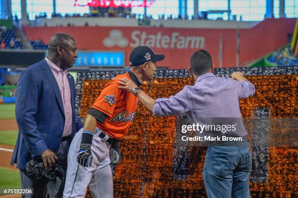 President of the Miami Marlins David P. Samson and President of Baseball Operations Michael Hill honor Ichiro Suzuki of the Miami Marlins for his...