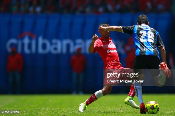 Erbin Trejo of Toluca fights for the ball with Jaime Gomez of Queretaro during the 16th round match between Toluca and Queretaro as part of the...