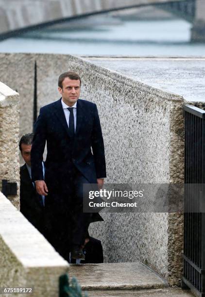 President of the political movement 'En Marche!' and candidate for the French presidential election Emmanuel Macron leaves the "Memorial des Martyrs...